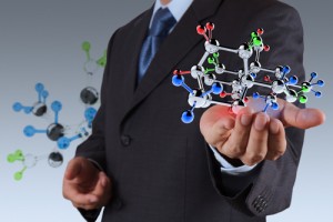 businessman holding a chemcial molecule as science concept